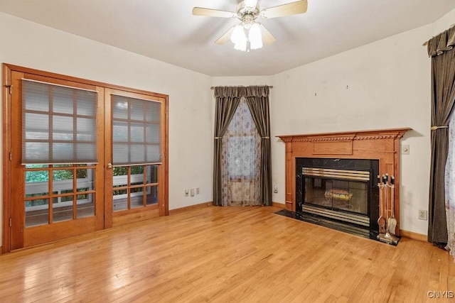 814 Oswego St, Salina, NY 13088 - unfurnished living room featuring light wood finished floors, ceiling fan, and a premium fireplace