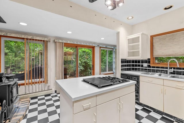814 Oswego St, Salina, NY 13088 - kitchen featuring light flooring, stainless steel gas cooktop, healthy amount of natural light, light countertops, and recessed lighting