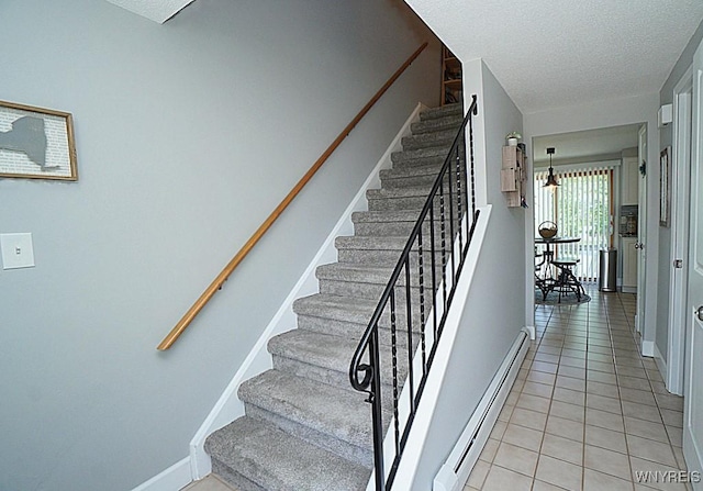 3190 Clearview Way, Hamburg, NY 14219 - staircase featuring a baseboard radiator, tile patterned flooring, and a textured ceiling