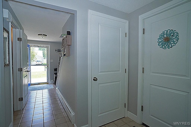 3190 Clearview Way, Hamburg, NY 14219 - corridor with a textured ceiling and light tile patterned flooring