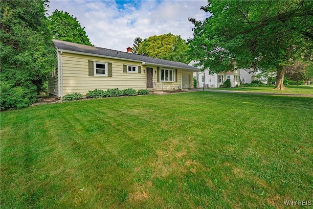 14 Euclid Ave, Lockport-City, NY 14094 - ranch-style home featuring a garage, a front yard, and a chimney