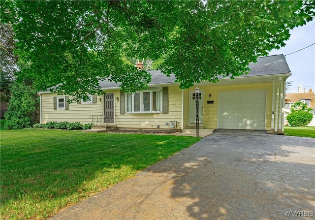 14 Euclid Ave, Lockport-City, NY 14094 - view of front facade with asphalt driveway, a garage, a front lawn, and roof with shingles