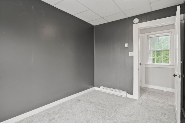 328 W Main St, Palmyra, NY 14522 - carpeted spare room with baseboard heating and a paneled ceiling