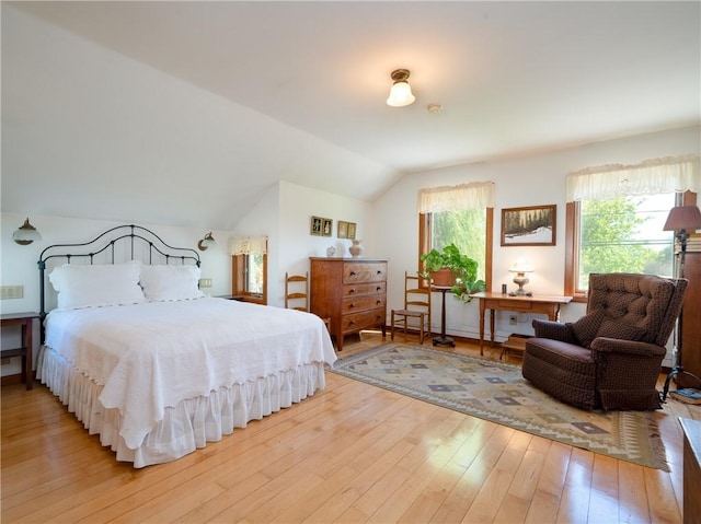 11037 Pratt Ln Unit 21, Yates, NY 14098 - bedroom featuring hardwood / wood-style flooring and vaulted ceiling