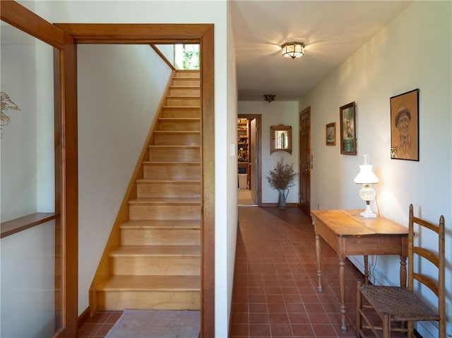 11037 Pratt Ln Unit 21, Yates, NY 14098 - stairs with tile patterned flooring and baseboards