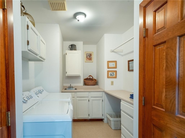 11037 Pratt Ln Unit 21, Yates, NY 14098 - laundry room with cabinet space and washer and clothes dryer