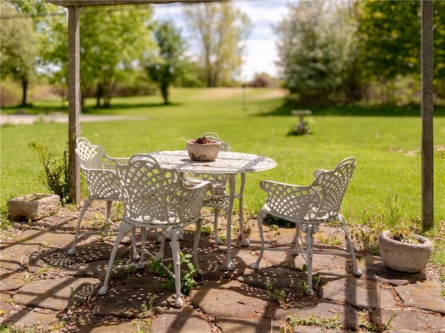 11037 Pratt Ln Unit 21, Yates, NY 14098 - view of green lawn featuring a patio and outdoor dining area