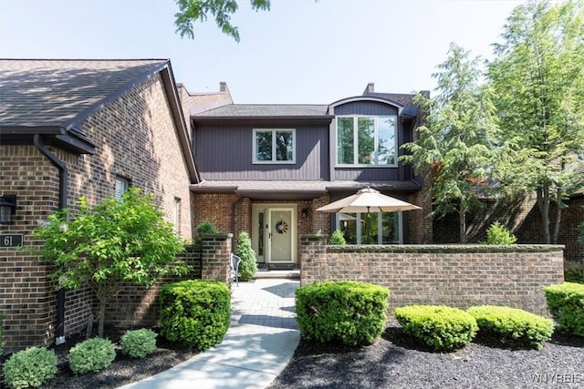 61 Hidden Ridge Cmn, Amherst, NY 14221 - view of front of house with brick siding