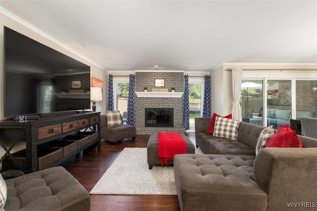 61 Hidden Ridge Cmn, Amherst, NY 14221 - living room with crown molding, wood finished floors, and a brick fireplace