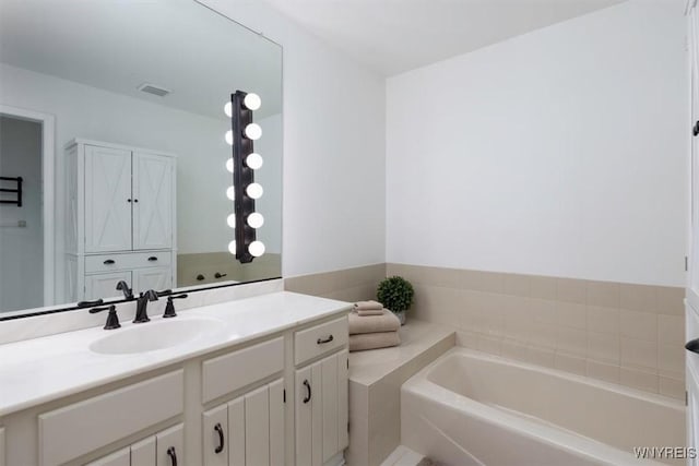 61 Hidden Ridge Cmn, Amherst, NY 14221 - bathroom featuring a garden tub and vanity
