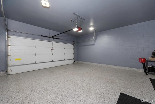 61 Hidden Ridge Cmn, Amherst, NY 14221 - garage with concrete block wall and a garage door opener