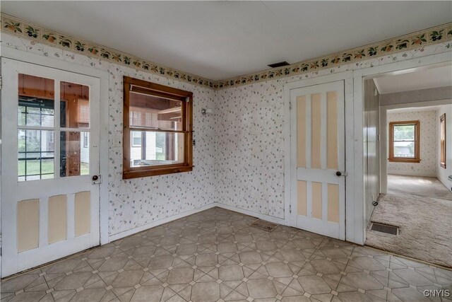9569 Church St, Denmark, NY 13620 - empty room featuring wallpapered walls and light flooring