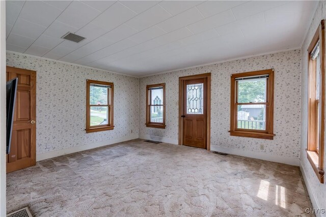 9569 Church St, Denmark, NY 13620 - carpeted entrance foyer with ornamental molding and wallpapered walls
