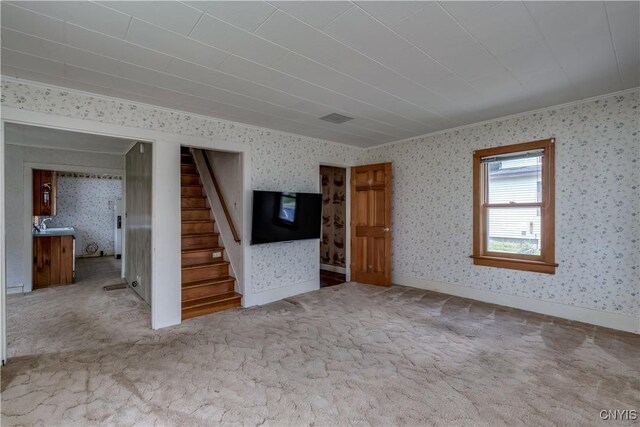 9569 Church St, Denmark, NY 13620 - unfurnished living room featuring wallpapered walls, stairway, and carpet floors