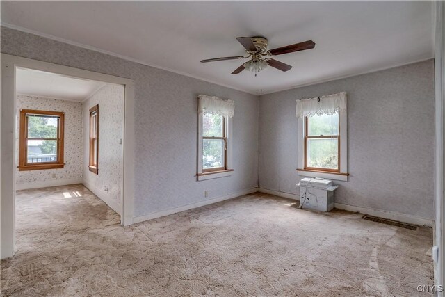 9569 Church St, Denmark, NY 13620 - carpeted empty room featuring crown molding, healthy amount of natural light, and a ceiling fan