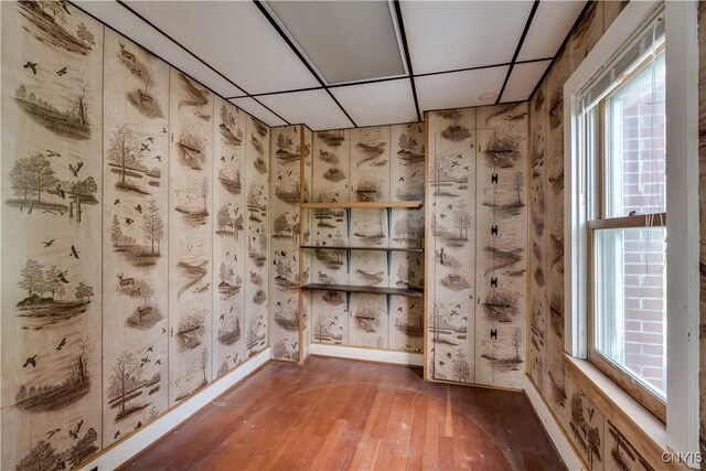 9569 Church St, Denmark, NY 13620 - empty room featuring hardwood / wood-style floors and a drop ceiling