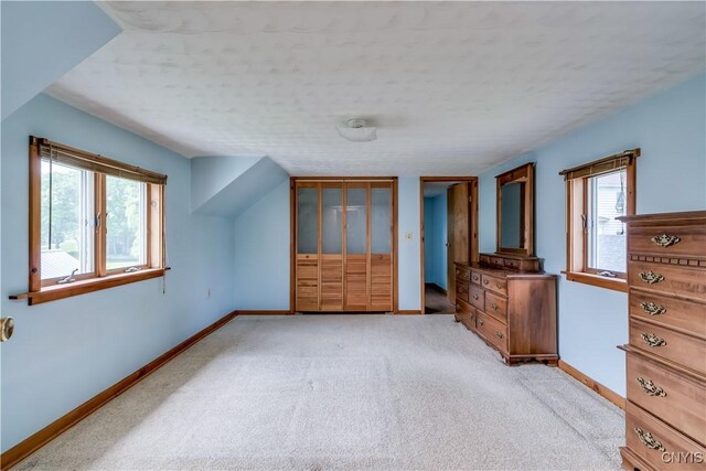 9569 Church St, Denmark, NY 13620 - unfurnished bedroom with carpet and two closets