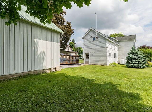 9569 Church St, Denmark, NY 13620 - view of green lawn featuring a deck
