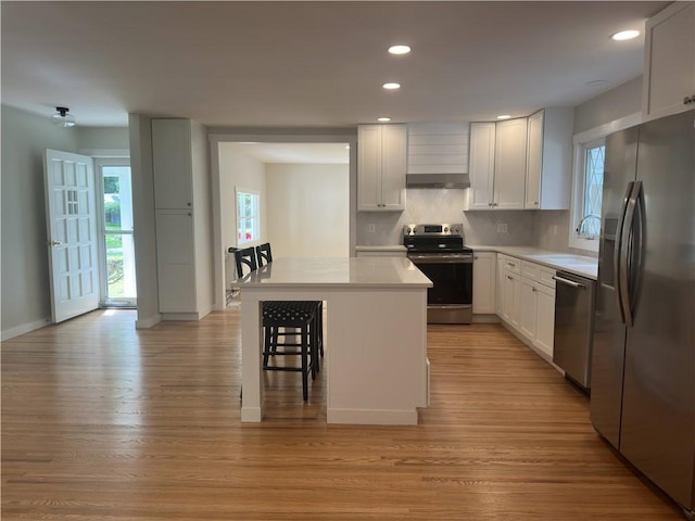 43 Harvest Rd, Perinton, NY 14450 - kitchen with stainless steel appliances, plenty of natural light, backsplash, light countertops, and recessed lighting