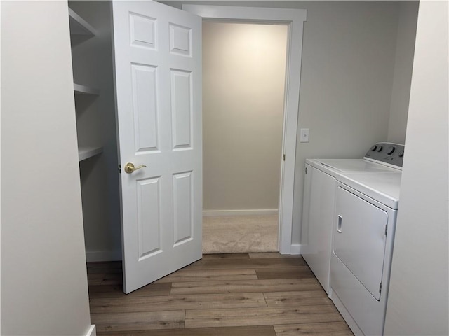 43 Harvest Rd, Perinton, NY 14450 - washroom with washer and clothes dryer and light wood-type flooring