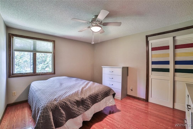 265 Miller Rd, Amherst, NY 14068 - bedroom with a textured ceiling, light wood-type flooring, a ceiling fan, and a closet