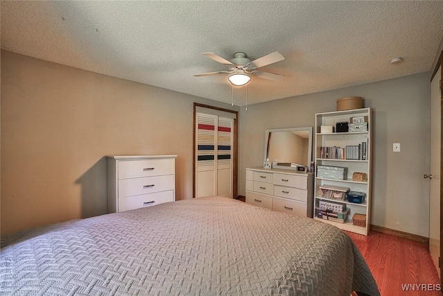 265 Miller Rd, Amherst, NY 14068 - bedroom featuring wood finished floors, a ceiling fan, a closet, and a textured ceiling
