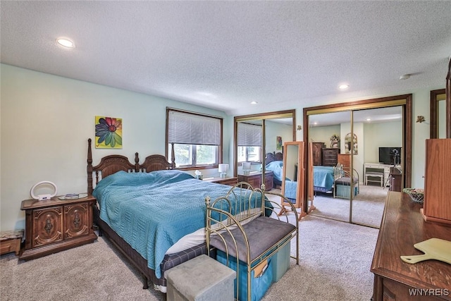 265 Miller Rd, Amherst, NY 14068 - bedroom with two closets, carpet floors, recessed lighting, and a textured ceiling