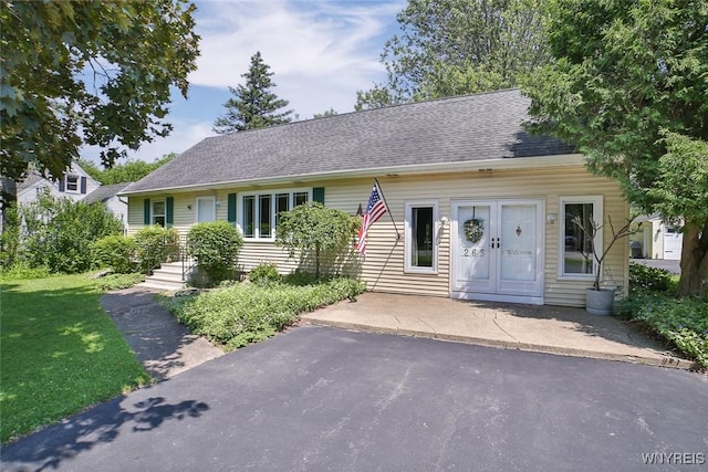 265 Miller Rd, Amherst, NY 14068 - view of front of property with roof with shingles and a front lawn
