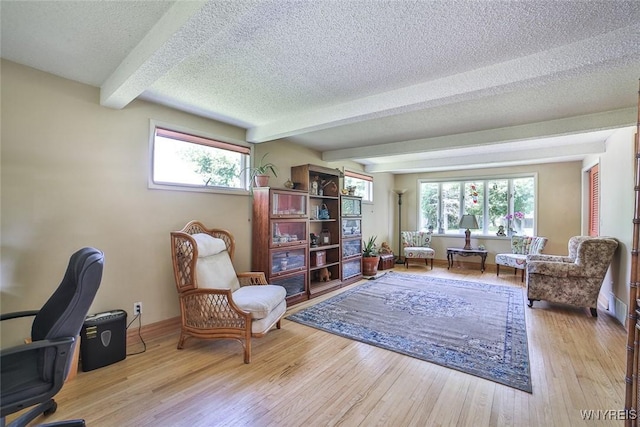 265 Miller Rd, Amherst, NY 14068 - home office with beamed ceiling, a textured ceiling, healthy amount of natural light, and wood finished floors