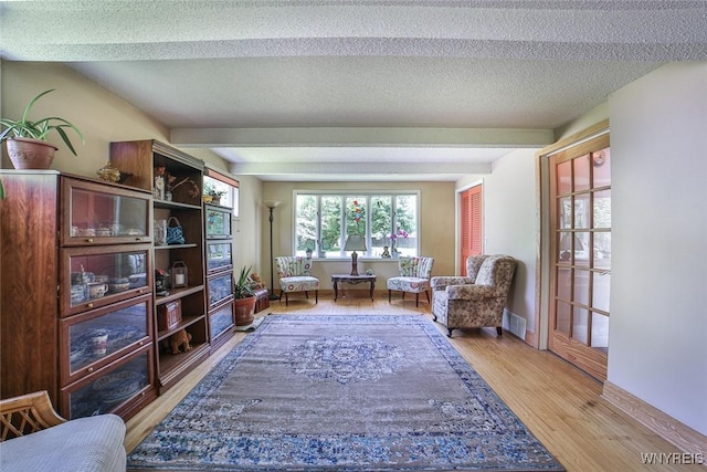 265 Miller Rd, Amherst, NY 14068 - living area featuring wood finished floors and a textured ceiling