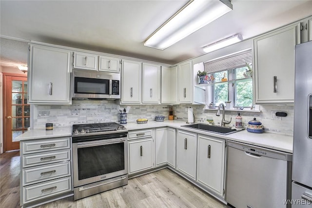 265 Miller Rd, Amherst, NY 14068 - kitchen featuring appliances with stainless steel finishes, light countertops, and backsplash