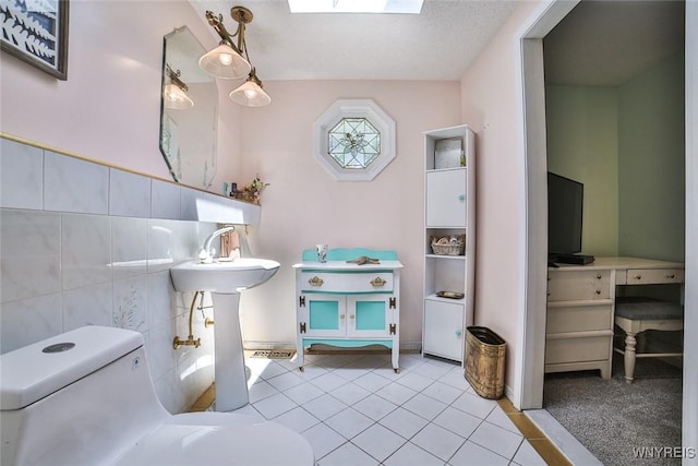 265 Miller Rd, Amherst, NY 14068 - half bath with tile patterned flooring and tile walls