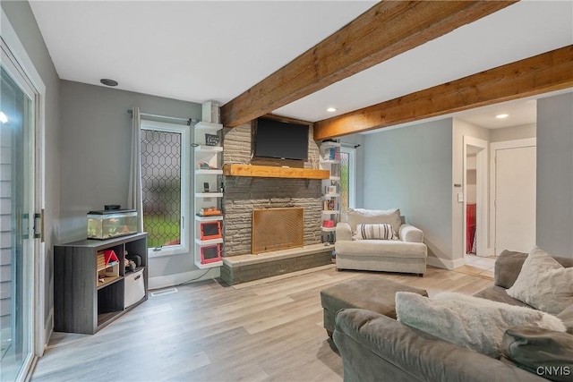 129 Quartz, Camillus, NY 13219 - living room featuring wood finished floors, a fireplace, recessed lighting, and beam ceiling