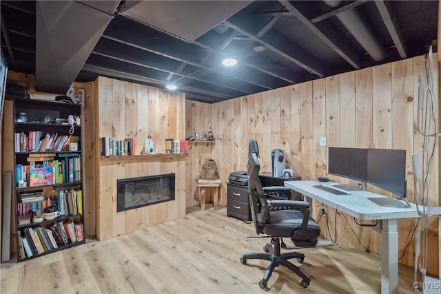 129 Quartz, Camillus, NY 13219 - office featuring wood finished floors, a glass covered fireplace, and wood walls