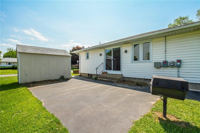 65 Meyerhill Cir E, Irondequoit, NY 14617 - back of property with entry steps, a patio area, and a lawn