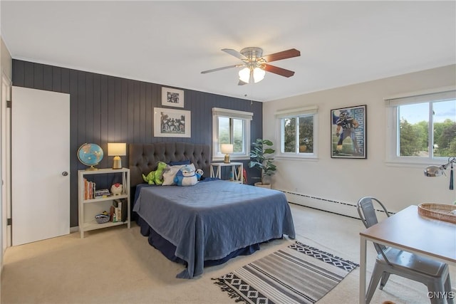 2304 Euclid Ave, Syracuse, NY 13224 - bedroom with multiple windows, light carpet, and baseboard heating