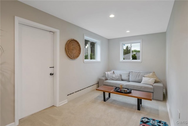 2304 Euclid Ave, Syracuse, NY 13224 - living room featuring a baseboard radiator, light carpet, and recessed lighting