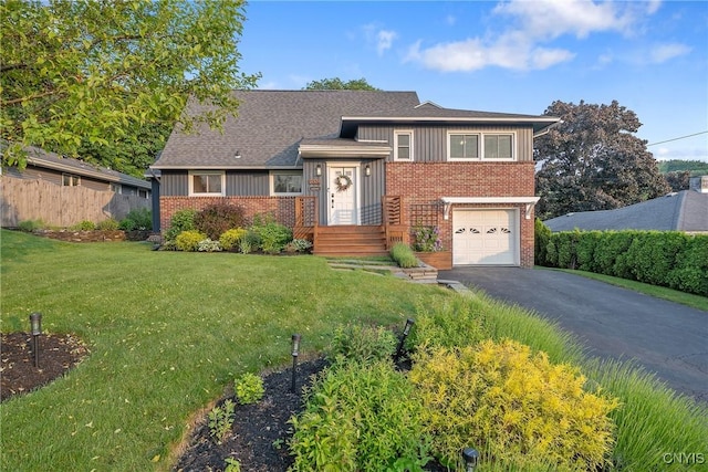 2304 Euclid Ave, Syracuse, NY 13224 - tri-level home with brick siding, board and batten siding, an attached garage, and asphalt driveway