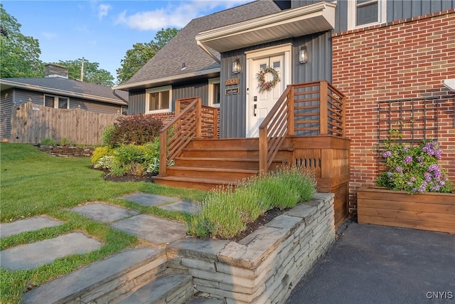 2304 Euclid Ave, Syracuse, NY 13224 - entrance to property with roof with shingles, brick siding, and board and batten siding