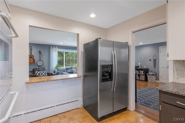 2304 Euclid Ave, Syracuse, NY 13224 - kitchen featuring stainless steel fridge, a baseboard radiator, and recessed lighting