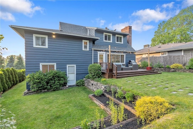 2304 Euclid Ave, Syracuse, NY 13224 - rear view of house with a wooden deck, a chimney, a garden, an outdoor living space, and roof with shingles