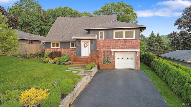 2304 Euclid Ave, Syracuse, NY 13224 - tri-level home with brick siding, asphalt driveway, an attached garage, board and batten siding, and roof with shingles