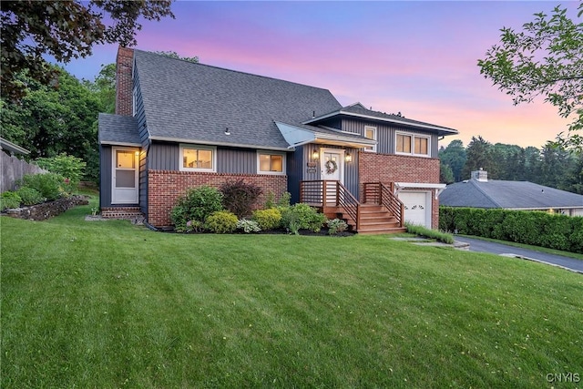 2304 Euclid Ave, Syracuse, NY 13224 - tri-level home with brick siding, driveway, roof with shingles, and board and batten siding