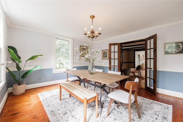 4 Park Pl E, Bloomfield, NY 14469 - dining space with a chandelier, hardwood / wood-style floors, crown molding, and french doors