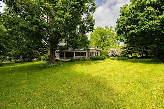 4 Park Pl E, Bloomfield, NY 14469 - view of grassy yard with a sunroom