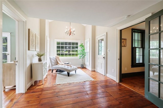 4 Park Pl E, Bloomfield, NY 14469 - entryway featuring wood-type flooring, a chandelier, and healthy amount of natural light