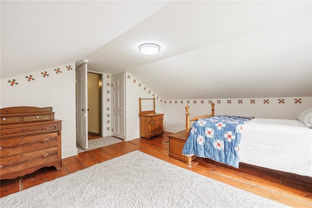 4 Park Pl E, Bloomfield, NY 14469 - bedroom featuring vaulted ceiling and wood finished floors