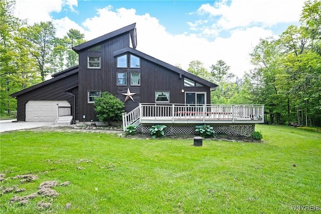 12261 Transit Line Rd, Concord, NY 14141 - back of property featuring a wooden deck, a lawn, driveway, and a garage