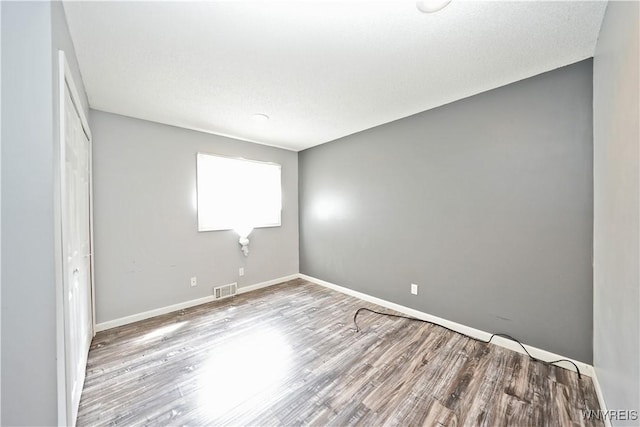 12261 Transit Line Rd, Concord, NY 14141 - unfurnished bedroom featuring wood finished floors and baseboards