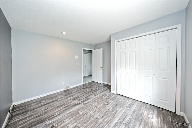 12261 Transit Line Rd, Concord, NY 14141 - unfurnished bedroom with wood finished floors, a closet, and recessed lighting